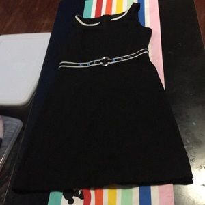 Gorgeous Black dress w/ white belt. Form fitting.